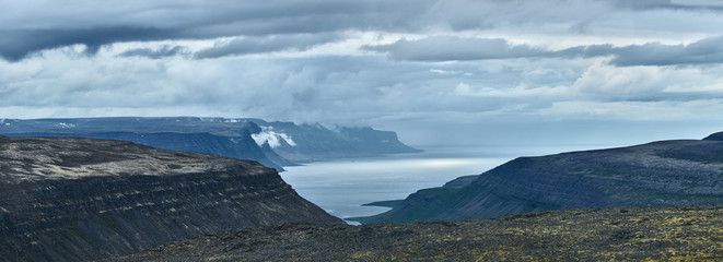 Travel to Iceland. beautiful cloudy sky over fjord in the north-west of Iceland, on the Westfirdir peninsula in Iceland.