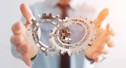 Businessman using floating modern gear mechanism 3D rendering