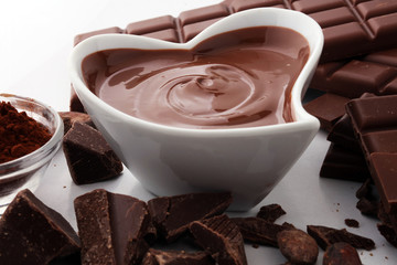 Melting chocolate or melted chocolate and chocolate swirl. stack and powder.