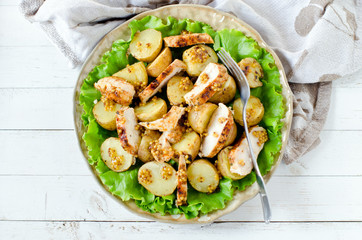 Warm salad of chicken and potatoes with mustard dressing