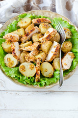 Warm salad of chicken and potatoes with mustard dressing