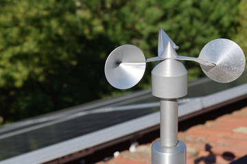 close up of aluminum anemometer on roof