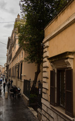 old roman city's historic buildings, houses and streets in a gray cloudy day