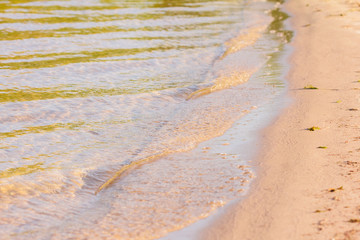 Sandy beach of ocean coast or river wave.