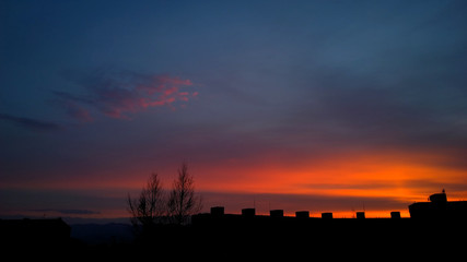 Sunrise and sunset over the buildings in the Zilina city. Slovakia