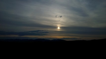 Clouds and sunrays over the meadow. Slovakia