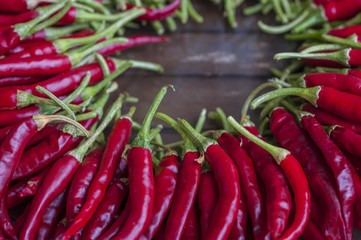 Chilli pepper on wooden background