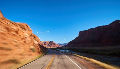 driving on road through castle valley, utah