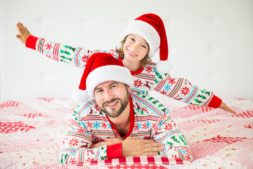 Obraz premium Happy family in Christmas eve