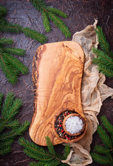 Christmas cooking background with cutting board and spices