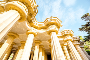 Naklejka premium Vew from below on the beautiful columns of the main terrace in Guell park in Barcelona