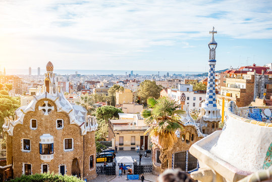 Cityscape view with colorful fairy buildings in the famous Guell park during the morning light in Barcelona
