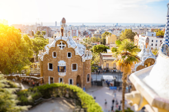 Cityscape view with colorful fairy buildings in the famous Guell park during the morning light in Barcelona