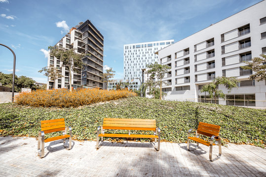 View on the garden with benches at the modern office disstrict in Barcelona city