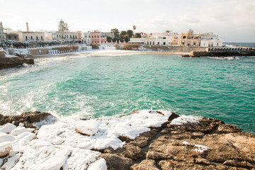 Santa Maria al Bagno beach after a exceptional snowfall, salento, italy