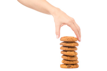 Female hand holding cookies with raisins isolated
