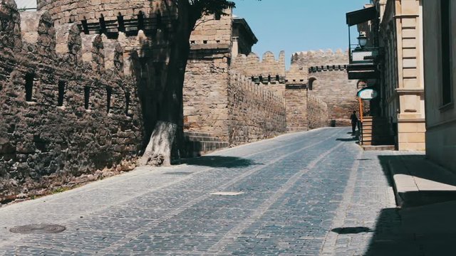 MAY 9, 2017 - AZERBAIJAN, BAKU: The walls of old city in Baku. Tourists walk on the sights of the capital of Azerbaijan
