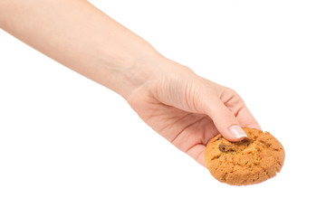 Female hand holding cookies with raisins isolated