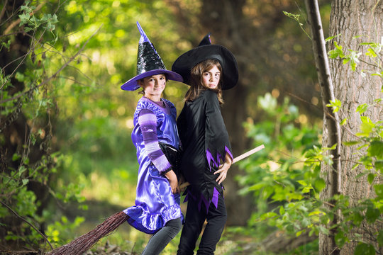 Two little witches on broom