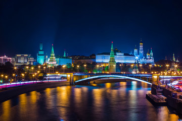Classic Moscow night postcard, the Kremlin on the river bank in front of the bridge, Place for text. Big Stone Bridge, The Moscow Kremlin, Russia.
