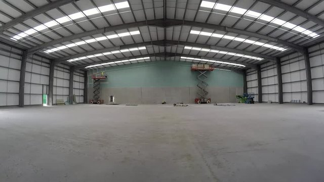 Taping and jointing the jumbo stud drywall at construction site of recycle centre timelapse