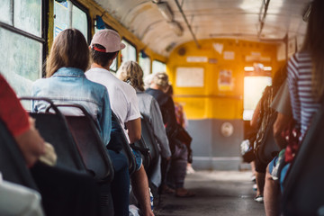 People have a ride in public transport from the work at sunset time - Powered by Adobe