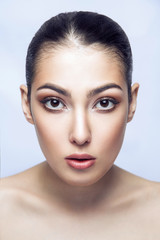 Fototapeta premium Naked young adult brunette looking at camera with sensual look. Portrait mixed race girl, have a perfect and clean skin.