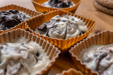 vanilla-chocolate dough for muffins before baking