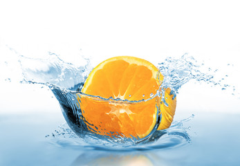 Fototapeta na wymiar Orange falling into the water