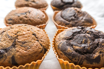 freshly baked tasty chocolate-vanilla muffins close-up