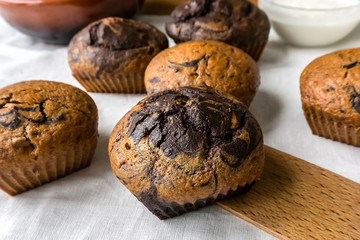 chocolate vanilla muffins on the table close up