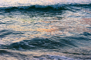 Fototapeta premium background texture - waves reflecting colors from the morning sky