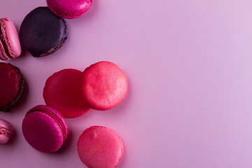 Pile of Macaroons cookies on pink background