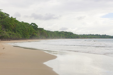 Tropical paradise beach in Costa Rica at cloudy day
