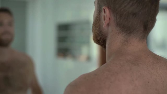 Man Checking His Appearance In The Mirror And Leaving The Bathroom, Steadycam Shot
