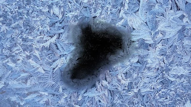 Beautiful frozen window melting animation from center to borders, timelapse defrost transition, natural dissolve, isolated on black background with black and white luminance matte, alpha channel.