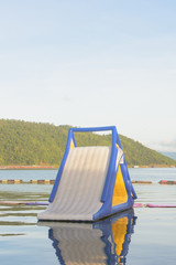 inflatable water park on the lake with The mountain in the background,kanchanaburi,thailand