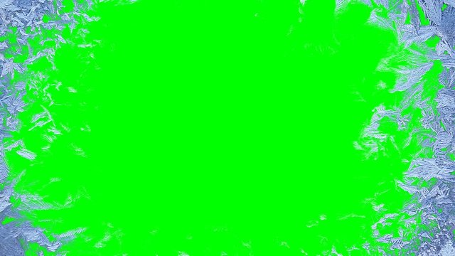 Beautiful window freezing animation from borders to center, timelapse frost forming transition, natural crystal icing, isolated on green chroma key background matte, alpha channel.
