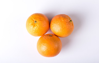 Fresh oranges over a white background