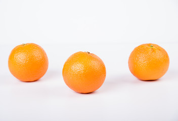 Fresh oranges over a white background