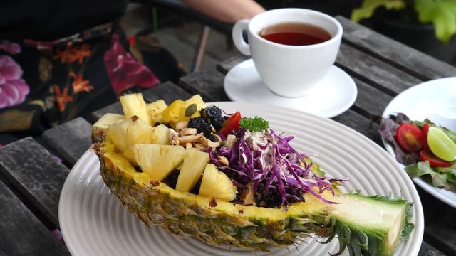 Closeup Of Thai Pineapple Stuffed With Fried Rice In Restaurant. 4K. 