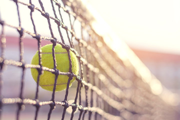 Close up Tennis ball hitting to net