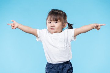 Lovely girl open hand palm over blue background