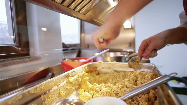 closeup of food preparation  cheff hands while in kithcen
