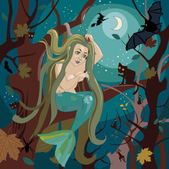 Obraz na płótnie Canvas Mermaid sits on a tree branch