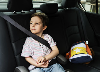 Boy into the Car Using Seatbelt Protect Security