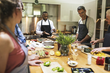 Group of friends are cooking in the kitchen