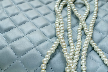 Pearls Isolated on Quilted Blue Background