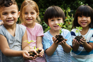 Group of kindergarten kids friends gardening agriculture