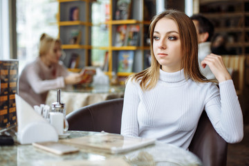 Woman waiting for somebody in cafe